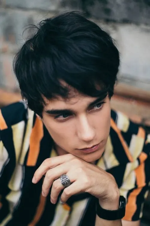 man with striped shirt wearing a silver ring