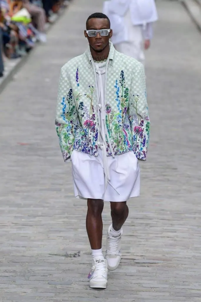 Man wearing a Louis Vuitton floral jacket and white shorts for SS20