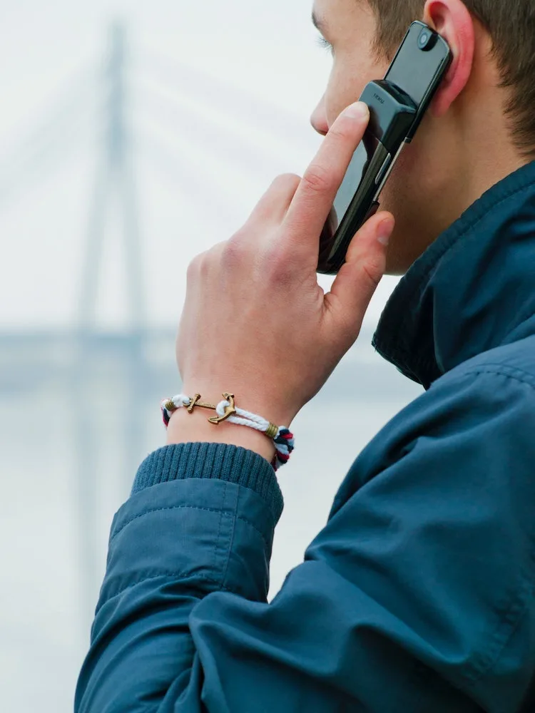 man flaunting bracelet