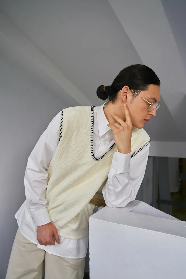 man flaunting sweater vest