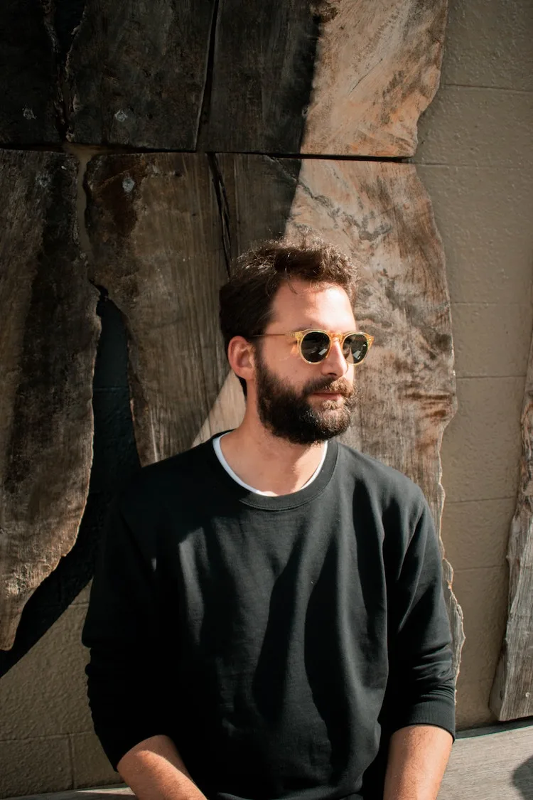 man wearing black crew neck sweater