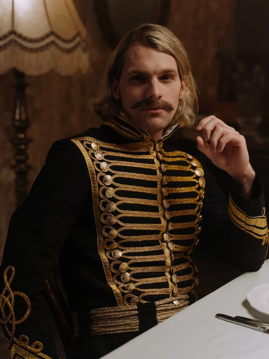 19th century man with long sideburns